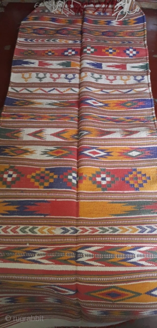 Durrie handwoven of cotton with vibrant colours with geometrical design all over from Thar desert region of Rajasthan India.the durrie is in very find condition without any holes or stains.the size of  ...