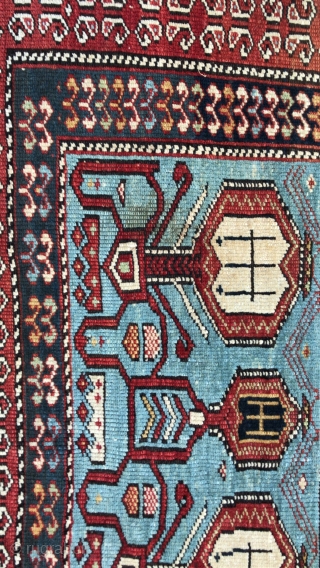  This is an antique Tachte Shirvan rug woven during the last quarter of the 19th century circa 1880. It has a rare powder blue background color with an even more rare  ...