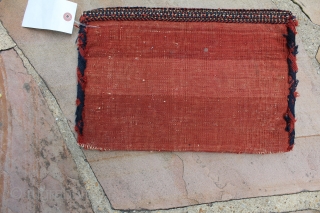 This is an antique Afshar chanteh circa 1900 and measures 1'.2"x 10".  Its in full pile condition and has its original kilim back. It has a golfarang design set on a  ...