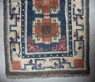 19th century small sized tibetan rug with white border, nice  natural dyes and quite good pile. tibet, approx 110x 65cm.            