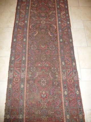 an early north-west persian long rug, possibly kurdish, with a very unusual colour palette, all natural with different purples and light indigo abrash. ends and selvedge partially worn but more or less  ...