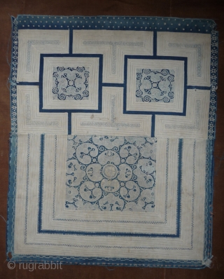 very nice old cotton panel from the miao peoples. indigo reserve technique, one small patch in the central panel. china, yunnan province, first half 20th c, 47x 57cm.     