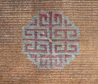 beautiful early tibetan monastic bench cover fragment with floating guls on an empty brown space. lovely patinated old colors, the black color in places is a natural brown overdyed with dark indigo.super  ...
