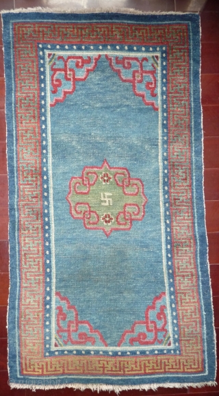 tibetan khaden mid 19th c whith very good colors and good condition, pile is bit low in its exeptional blue field.            