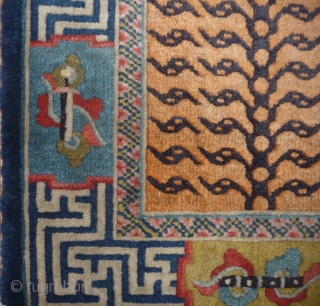 a very special chinese small tiger rug made probably in northeast china for northwest china, as it cames  some years ago out of a buddhist monastery in the qinghai province (possibly  ...