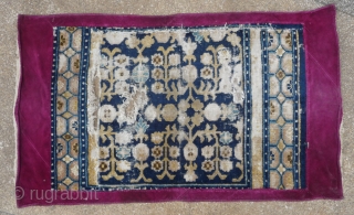 fragment of an early rare ningxia carpet. this design mostly found on eastturkestan carpets is extremly rare on ningxia (of this age!), possibly unique? the remnant corner of which must has been  ...