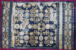 fragment of an early rare ningxia carpet. this design mostly found on eastturkestan carpets is extremly rare on ningxia (of this age!), possibly unique? the remnant corner of which must has been  ...