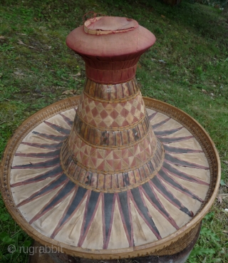 this is a beautiful and rare antique indonesian hat from the south sulawesi. it is made of palm leaves, decorated with pieced cloth and embroidery.the round base is perhaps bambu. please note  ...