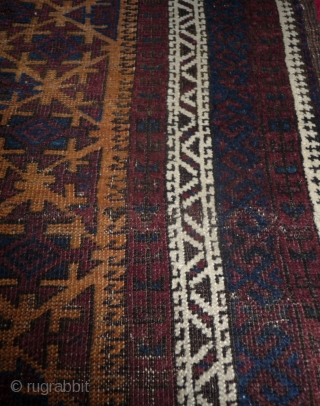 beautiful baluch prayer rug with prayer wear.attrativ hand panel and turkmen field design with a strong reciprocity effect.lots of interesting small amulets. all natural colors with very nice apricot ground color.silk highlights  ...