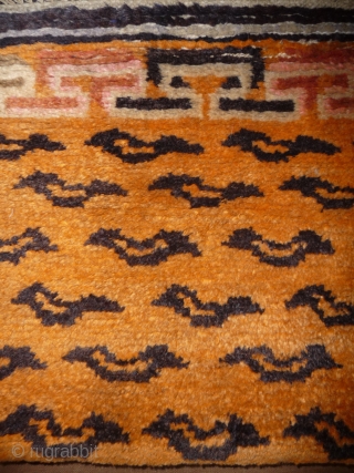 not a tibetan weaving but this small tiger rug was intented for a tibetan monastery to be hung in a door way or as pillar decoration. despite of its late 19thc or  ...
