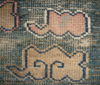 all about clouds. an early 20th century tibetan popart rug with an abrashed green sky background. damage but a funny unique piece; note the integration of a cloud design in the traditional  ...