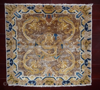 finely woven chinese ningxia square with well drawn 5 dragons design, background tan-red color corroded, around 1800.                