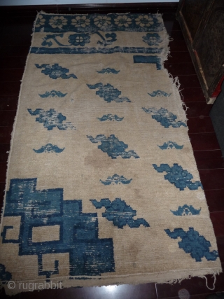 this an early chinese rug in fragmentary condition but this is not a fragment of bigger rug as is is attested by the original ends and selvedge. the fact that it looks  ...