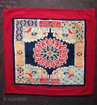 superb tibetan lama seating mat with a bold lotus center. very good condition. first quarter of the 20th century.. rare!             