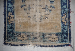 very worn, very early, very rare. very interesting. a 75x 133cm chinese rug, most probably a sleeping rug, and possibly one of those carried originally by the travelling rider. wonderfully drawn large  ...