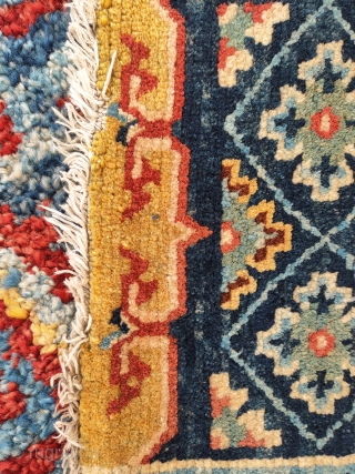 one half of a very unusually small saddle rug 36x 52cm
great naturall colors including a goldish yellow and deep aubergine. super weave and wool not later than late 19th century  detail  ...