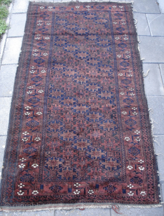 Baluch rug from the late 19th century. Soft pliable handle, fine weave, shiny wool. Corroded browns. Just great. 

179cm x 96cm 

70 inch x 38 inch

       