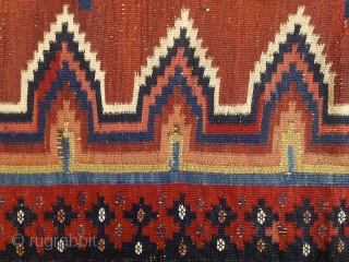 Afshar kilim, 2nd half of 19th century, 180X115cm. 3 rythmical diamonds on a brick-red ground, sorrounded by eye dazzler, rainbow-like saf-bordure. The main field repose the eyes between the vibtaring, multiple borders.  ...