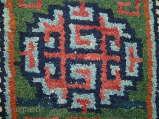 A "Wangdan", 19th century Tibet little rug.  Size is 27 X 42 inches. Perfect condition and unusual weave - see shot or reverse.         