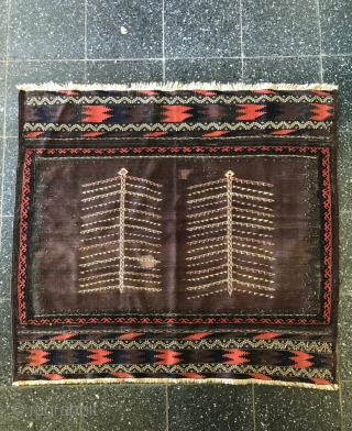 An old Baluch Sofreh about 100 years,size:120x115 cm,wool on wool,very unusuall tree design,two old repairs.pls not to hesitate to ask me any question about this nice Baluch.      