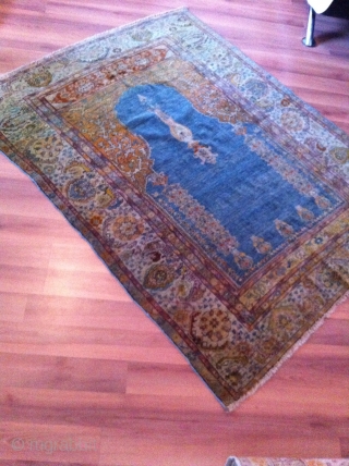An old turkish or probably North persian prayer rug with the size 155/125 cm. Good shape with reduced endings. Part silk frings.           