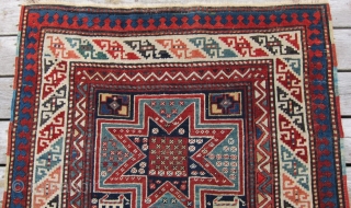 Late 19th c. Gendje, 3'8" x 9'1".  A very attractive long rug featuring lovely stars and animals in very good condition.           