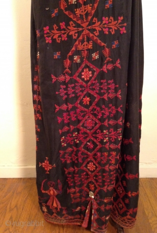 This is a beautiful Palestinian embroidered dress. it has a signature ...