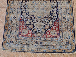 An antique Tabriz rug from the renowned Hadji Jalili workshops, 138 x 192 cm. late 19 th. century. The design with a central star-shaped medallion in ethereal blue, extending out into a  ...