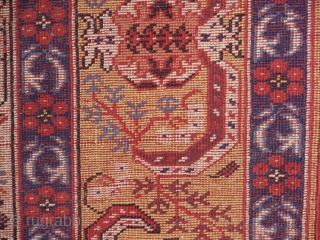 A fine and accurate reproduction of a 17 th. century "Transylvanian" prayer rug.  West Anatolian. 125 x 120 cm. The prayer niche with arabesque spandrels and a mustard yellow main border  ...