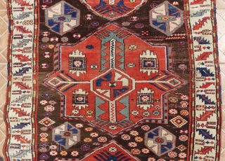 Kazak with Akstafa medallions, Bordjalou region.  124 x 240 cm. Around 1900. Nice condition with slight corrosion of the dark brown ground.          