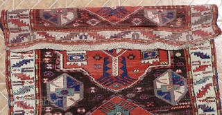 Kazak with Akstafa medallions, Bordjalou region.  124 x 240 cm. Around 1900. Nice condition with slight corrosion of the dark brown ground.          