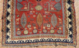 An antique Salyan Shirvan rug, SW Caucasus. 185 cm x 125 cm. This extraordinary and charismatic rug shows a central Fachralo medallion, flanked by four Akstafa peacocks. Three hexagonal Bordjalou shield motifs  ...