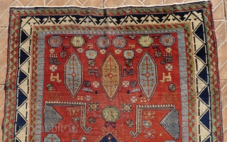 An antique Salyan Shirvan rug, SW Caucasus. 185 cm x 125 cm. This extraordinary and charismatic rug shows a central Fachralo medallion, flanked by four Akstafa peacocks. Three hexagonal Bordjalou shield motifs  ...