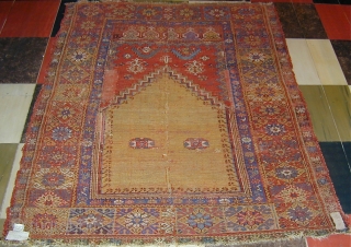 Mudjur prayer rug vertically cut and sewn back together  (see detail..Approx 2'' missing),65'' X 48''(165 X 123cm.),
18th. century.              