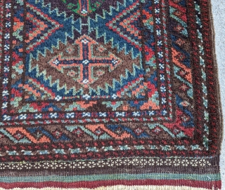 A colourful Baluch balisht (front) from the Sistan region. Excellent condition, with full, lustrous pile. 96 x 52 cm.              
