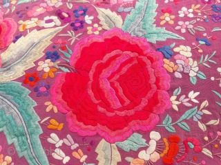 OLD SHAWL

5 1/2 foot square with 18" fringe containing diamond pattern.
Fushia silk crepe and silk knotted fringe
Covered with floral pattern with 12" and 6" diameter roses of 
hand satin stitch embroidery
2 1/2"  ...