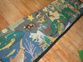 A rare American Hooked rug from the early part of the 20th century showing the southern part of the United States with various different type of animals.  Size is 3'x13' Condition  ...