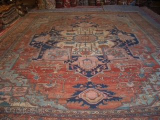 A very early Heriz Serapi carpet with highly desirable palette of tones. About 11'x14'4" = 336x437 cm. Repair galore!              