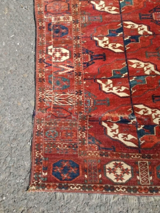 An antique Tekke main carpet  . 220/200 cm. Very old and Fine. Some repairs. Original size.                