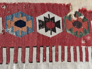 This impressive white-ground kilim fragment is a weaving from the Aksaray area in central Anatolia. The hexagons with large double hooks are very broadly drawn. The impact of the design and colors  ...