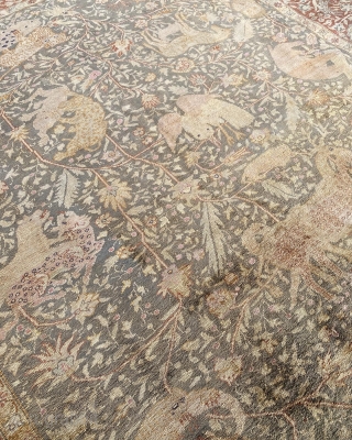 Animal Hunting Scene Kayseri Carpet, This finely woven Kayseri silk carpet displays in the expansive central field on a light pistachio-coloured ground, a painterly approach with images of animals in combat against  ...