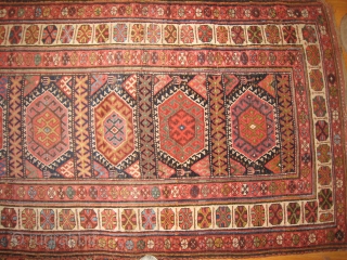 An uncommon Kurdish Long Rug with 11 or so medallions.                       