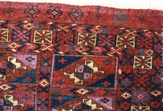 Antique Tekke Aina Gol Chuval / 1.07m. x .72m.
Circa mid 19th c.
Good condition, partial original selvedge, no restoration, just securing of the sides. Extensive use of deeply corroded  magenta silk .  ...