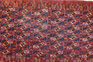 Antique Tekke Aina Gol Chuval / 1.07m. x .72m.
Circa mid 19th c.
Good condition, partial original selvedge, no restoration, just securing of the sides. Extensive use of deeply corroded  magenta silk .  ...