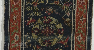 Tibet – Mid 19th century, unusually well made incorporating ½ and ¼ knots.  
Lots of Chinese influence.  Measures 154cm x 68cm.  All natural colors.  
    