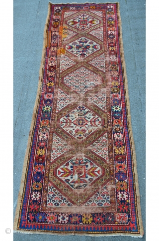 NWP Kurdish rug with camelhair border, 347 x 121 cm, some old re-knotting with faded away colors, beautiful drawings.              