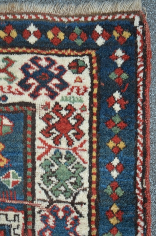 Lovely Kazak from south Georgia / Caucasus. Beautiful abrash in the outer blue-green border. High floor, but some places much worn, 191 x 107 cm        