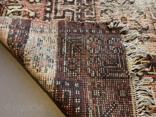 Pretty battered Khotan rug. First half 19th century, 220 x 112 cm                     