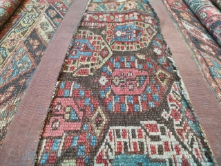 Antique Malayar Kurd runner from Northwest Persia ca.1900- 442cmx100/106cm stretched. This runner has been cut and shows traces of repairs. Suggestion, Use to make pillow cases or handbags. 

So old and still  ...
