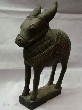   Wooden Nandi(Bull) Toy.

  A Nandi for childrens from Central Maharashtra (Central India).

 A Nandi use as a Toy for Special yearly festival of Maharashtra name as ( Pola festival).  ...